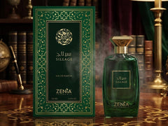 Zenia Sillage perfume bottle and packaging on a wooden surface with decorative background